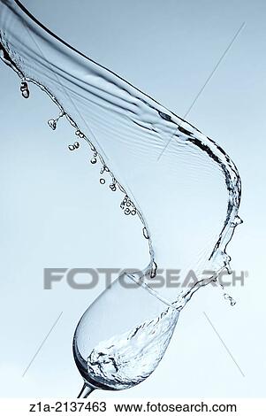 Water splash on a gradient blue background. View Large Photo Image Stock Image - Water splash on a gradient blue background.. Fotosearch