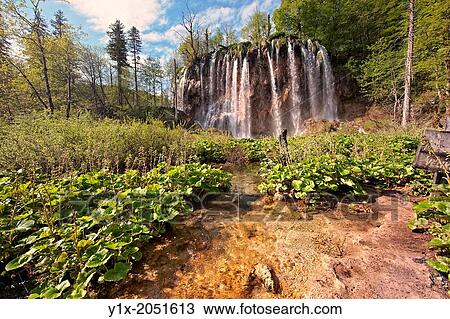 Waterfall over the travatine terraces of Plitvince National Park, Croatia. View Large Photo Image Stock Image - Waterfall over the travatine terraces of Plitvince National Park, Croatia.. Fotosearch