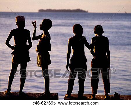 Stock Photography - Waterfront at sunset. Stone Town, Zanzibar Island, Tanzania. Fotosearch