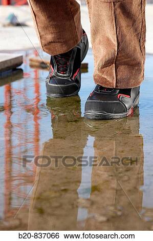 Waterproof safety boots, housing construction, construction site View Large Photo Image Stock Photograph - Waterproof safety boots, housing construction, construction site. Fotosearch