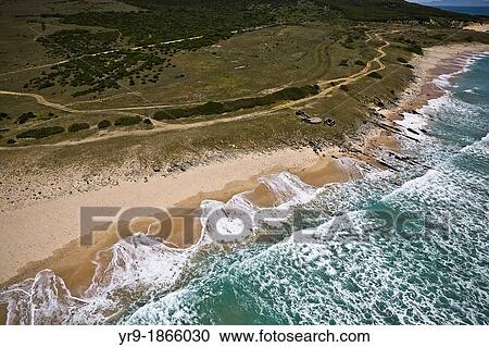 Waves breaking on Bolonia's beach, Aerial view. Tarifa, CBdiz area, Spain View Large Photo Image Stock Image - Waves breaking on Bolonia's beach, Aerial view. Tarifa, CBdiz area, Spain. Fotosearch