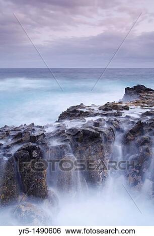 Stock Photograph - Waves breaking over rocks on north coast of Gran Canaria. Fotosearch