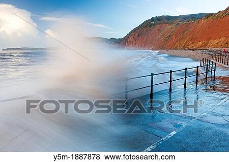 Waves crashing against walkway in Sidmouth, Devon, England, United Kingdom, Europe View Large Photo Image Stock Photo - Waves crashing against walkway in Sidmouth, Devon, England, United Kingdom, Europe. Fotosearch