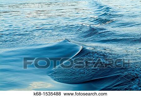Waves from the wake of a boat View Large Photo Image Stock Photo - Waves from the wake of a boat. Fotosearch
