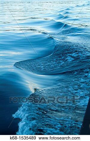 Stock Photo - Waves from the wake of a boat. Fotosearch