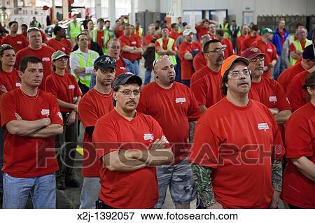 Wayne, Michigan - Members of the United Auto Workers at Ford Motor Co? s Michigan Assembly Plant wear red t-shirts in solidarity with public employees in Wisconsin and other states fighting against anti-union legislation View Large Photo Image Stock Photo - Wayne, Michigan - Members of the United Auto Workers at Ford Motor Co? s Michigan Assembly Plant wear red t-shirts in solidarity with public employees in Wisconsin and other states fighting against anti-union legislation. Fotosearch
