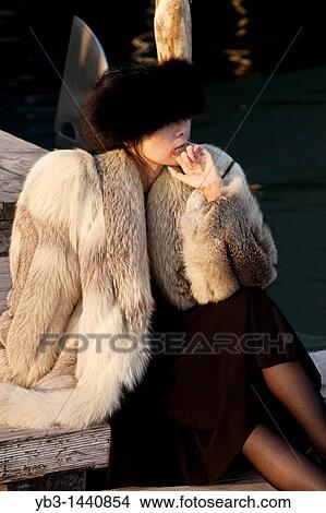 Wealthy tourist sitting down outside the Danieli hotel, Venice, Italy View Large Photo Image Picture - Wealthy tourist sitting down outside the Danieli hotel, Venice, Italy. Fotosearch