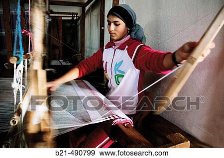 Stock Photo - Weaver at the women cooperative of Targha, in the Rif mountains. Rif. Morocco.. Fotosearch