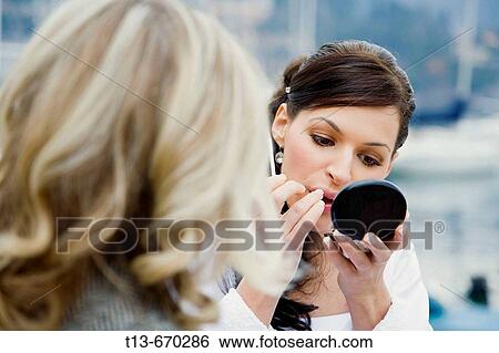 Wedding bride applying make-up View Large Photo Image Stock Photograph - Wedding bride applying make-up. Fotosearch