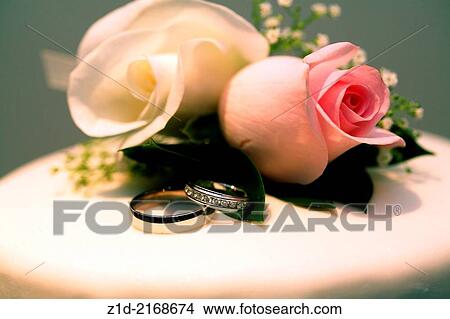 Wedding cakes and wedding rings. View Large Photo Image Picture - Wedding cakes and wedding rings.. Fotosearch