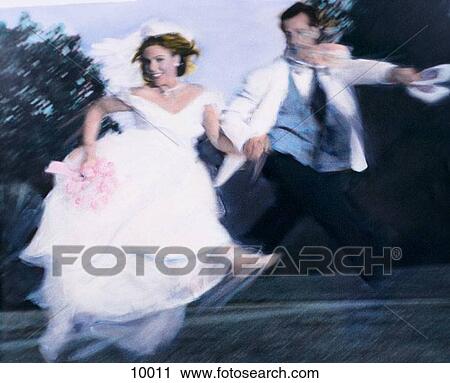 Wedding couple jump for joy View Large Photo Image Stock Image - Wedding couple jump for joy. Fotosearch