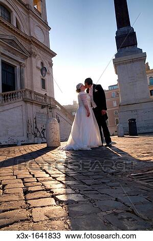 Wedding couple kissing at Trinita? dei Monti in Rome Italy View Large Photo Image Stock Image - Wedding couple kissing at Trinita? dei Monti in Rome Italy. Fotosearch