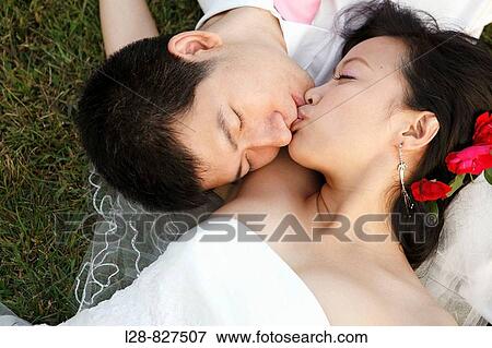 wedding couple kissing outdoor View Large Photo Image Stock Photo - wedding couple kissing outdoor. Fotosearch