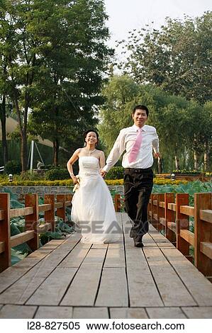 wedding couple running View Large Photo Image Stock Photography - wedding couple running. Fotosearch