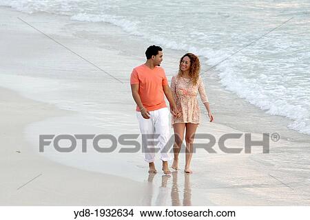 Wedding couple walking on the beach, Miami Beach, Florida, USA. View Large Photo Image Picture - Wedding couple walking on the beach, Miami Beach, Florida, USA.. Fotosearch