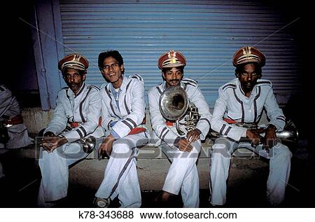 Wedding music band sits in street corner. Varanasi, India View Large Photo Image Stock Photo - Wedding music band sits in street corner. Varanasi, India. Fotosearch