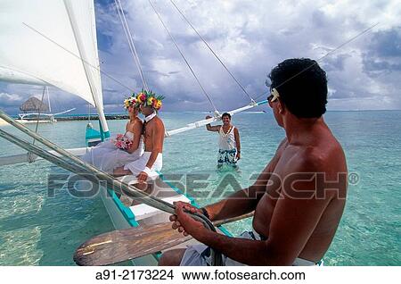Wedding on a sailing outrigger in the lagoon. Bora Bora. French Polynesia (MR) View Large Photo Image Picture - Wedding on a sailing outrigger in the lagoon. Bora Bora. French Polynesia (MR). Fotosearch