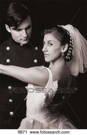 Stock Image - Wedding portrait of athletes in love dancing. Fotosearch