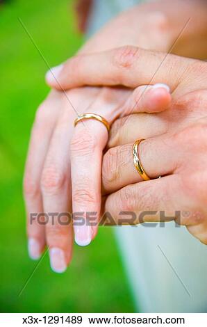 Wedding rings on each other hands View Large Photo Image Stock Photo - Wedding rings on each other hands. Fotosearch