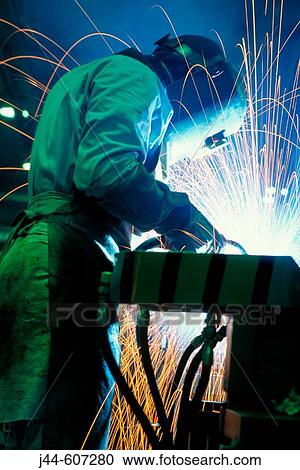 Welder at car manufacturer View Large Photo Image Stock Image - Welder at car manufacturer. Fotosearch