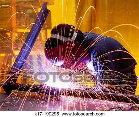 Welder working on bridge support View Large Photo Image Stock Photography - Welder working on bridge support. Fotosearch