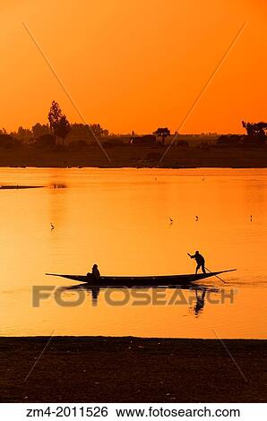 WEST AFRICA, MALI, MOPTI, BANI RIVER, LOCAL PEOPLE IN BOAT, SUNSET. View Large Photo Image Stock Photograph - WEST AFRICA, MALI, MOPTI, BANI RIVER, LOCAL PEOPLE IN BOAT, SUNSET.. Fotosearch