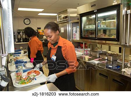 West Bloomfield, Michigan - Crystal Boykin right and Sandy Schwarze prepare lunch trays for hospital patients in the kitchen of Henry Ford West Bloomfield Hospital View Large Photo Image Stock Image - West Bloomfield, Michigan - Crystal Boykin right and Sandy Schwarze prepare lunch trays for hospital patients in the kitchen of Henry Ford West Bloomfield Hospital. Fotosearch