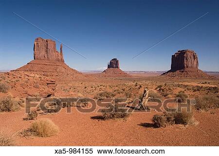 Stock Photography - West Mitten Butte left, East Mitten Butte center, and Merrick Butte right, Monument Valley Navajo Tribal Park, Arizona, USA. Fotosearch