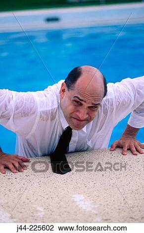 Wet businessman with shirt and tie getting out from pool View Large Photo Image Stock Image - Wet businessman with shirt and tie getting out from pool. Fotosearch