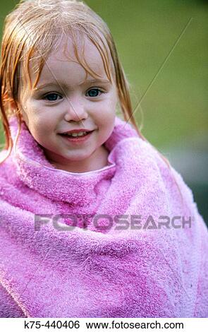 Wet child wrapped in towel View Large Photo Image Stock Photograph - Wet child wrapped in towel. Fotosearch