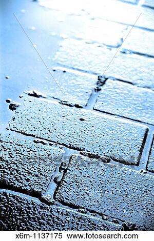 Stock Photography - wet sidewalk. Fotosearch