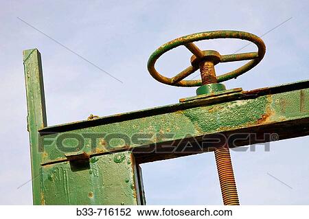 Wheel to open sluice gate View Large Photo Image Stock Image - Wheel to open sluice gate. Fotosearch