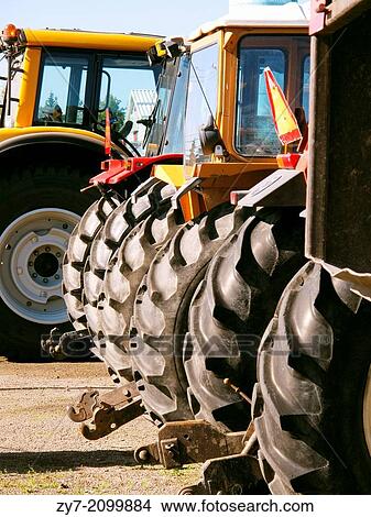 Wheels of tractors taken as clous-up. View Large Photo Image Picture - Wheels of tractors taken as clous-up.. Fotosearch