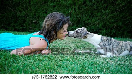 Stock Image - Whipped dog and girl. Fotosearch