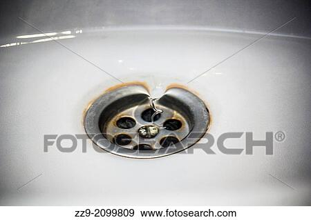 Whirlpool of water entering the drain. View Large Photo Image Stock Photo - Whirlpool of water entering the drain.. Fotosearch
