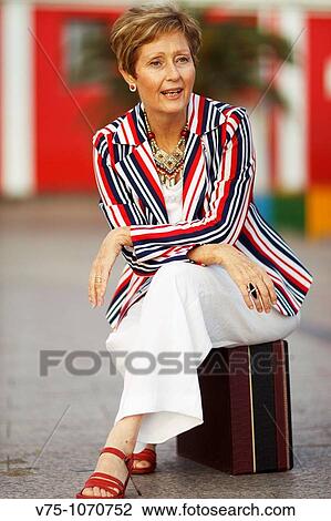 White, blue and red stripes dressed mature woman sitting View Large Photo Image Stock Image - White, blue and red stripes dressed mature woman sitting. Fotosearch