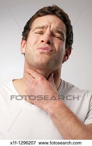 Stock Photo - White caucasian male man suffering with a sore throat. Fotosearch