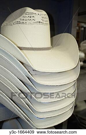 White cowboy hats on sales display in western outfit shopping center View Large Photo Image Stock Photo - White cowboy hats on sales display in western outfit shopping center. Fotosearch