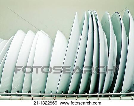 White dishes in drying rack. View Large Photo Image Stock Photo - White dishes in drying rack.. Fotosearch