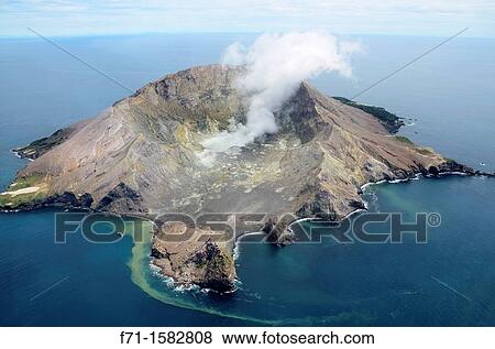 White Island is an active andesite stratovolcano, situated 48 km 30 mi from the east coast of the North Island of New Zealand, in the Bay of Plenty View Large Photo Image Stock Photo - White Island is an active andesite stratovolcano, situated 48 km 30 mi from the east coast of the North Island of New Zealand, in the Bay of Plenty. Fotosearch