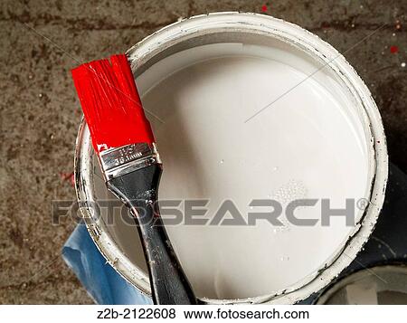 White paint tin with a paint brush holding red paint. View Large Photo Image Stock Photo - White paint tin with a paint brush holding red paint.. Fotosearch