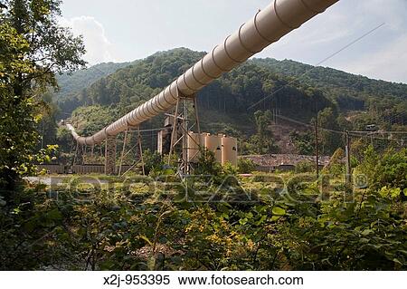 Stock Photography - Whitesville, West Virginia - A conveyor carries newly-mined coal from a mine across a highway and river to a preparation plant. Fotosearch