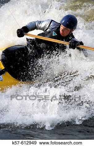 Stock Photo - Whitewater paddler on the Ottawa River, Canada. Fotosearch