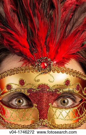 Wide opened eyes of a woman behind a venetian mask View Large Photo Image Stock Image - Wide opened eyes of a woman behind a venetian mask. Fotosearch