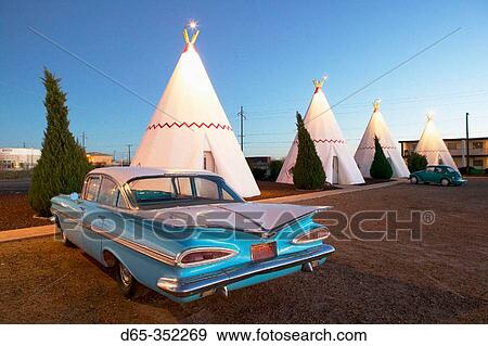 Stock Photo - Wigwam motel concrete teepees and 1959 Chevrolet on Route 66 at evening. Holbrook. Arizona, USA. Fotosearch