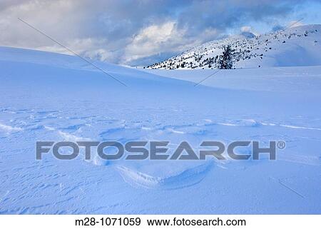 Wind blown snow also called sastrugi on ridge of Big Buck Mountain, Manning Provincial Park British Columbia Canada View Large Photo Image Stock Photo - Wind blown snow also called sastrugi on ridge of Big Buck Mountain, Manning Provincial Park British Columbia Canada. Fotosearch