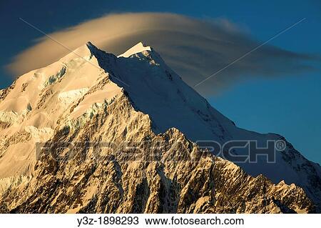 Wind cloud over summits Aoraki Mount Cook, sunset from Mt Kinsey, Aoraki Mount Cook National Park, Canterbury, New Zealand View Large Photo Image Stock Image - Wind cloud over summits Aoraki Mount Cook, sunset from Mt Kinsey, Aoraki Mount Cook National Park, Canterbury, New Zealand. Fotosearch