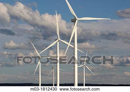 Stock Image - Wind farm, Nova Scotia, Canada, Amherst, Canadian Maritimes, wind turbine, green energy, electric power, windmills, blades, generating, clouds, sky.. Fotosearch