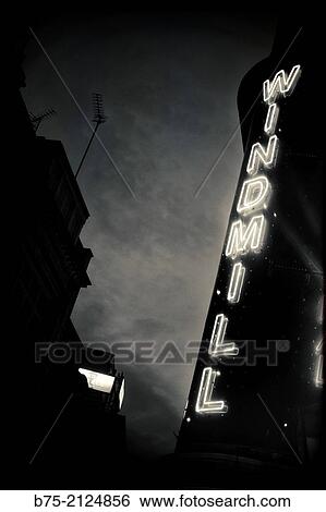 Wind Mill International sign in a facade at night in Soho, London, England, UK View Large Photo Image Stock Photograph - Wind Mill International sign in a facade at night in Soho, London, England, UK. Fotosearch
