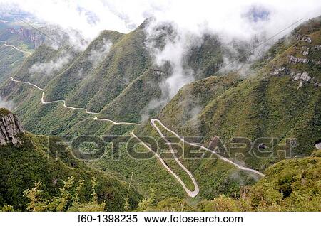 Winding road snakes along Serra do Rio do Rastro, Santa Catarina, connecting the Brazilian plateau with the coastal towns, Brazil. View Large Photo Image Stock Photography - Winding road snakes along Serra do Rio do Rastro, Santa Catarina, connecting the Brazilian plateau with the coastal towns, Brazil.. Fotosearch
